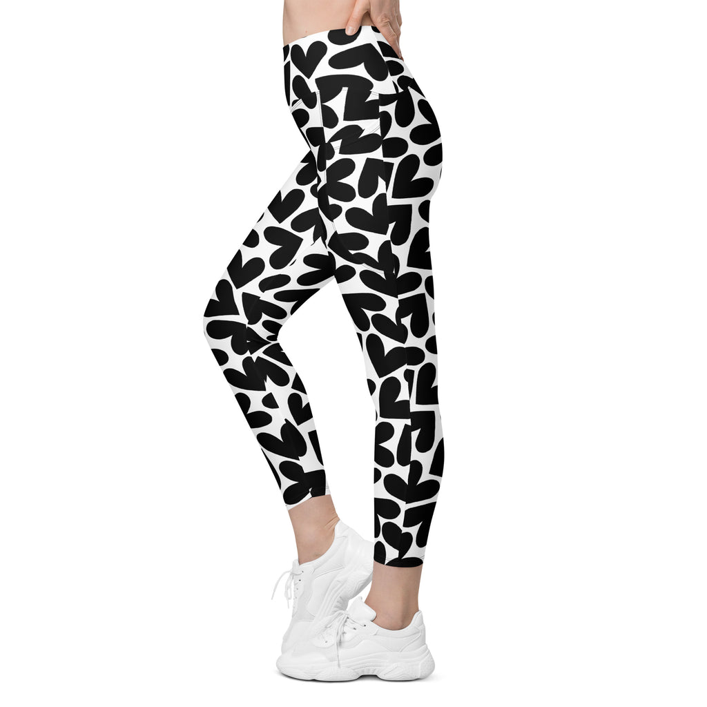 Black and white hearts print recycled yoga leggings with pockets, left view