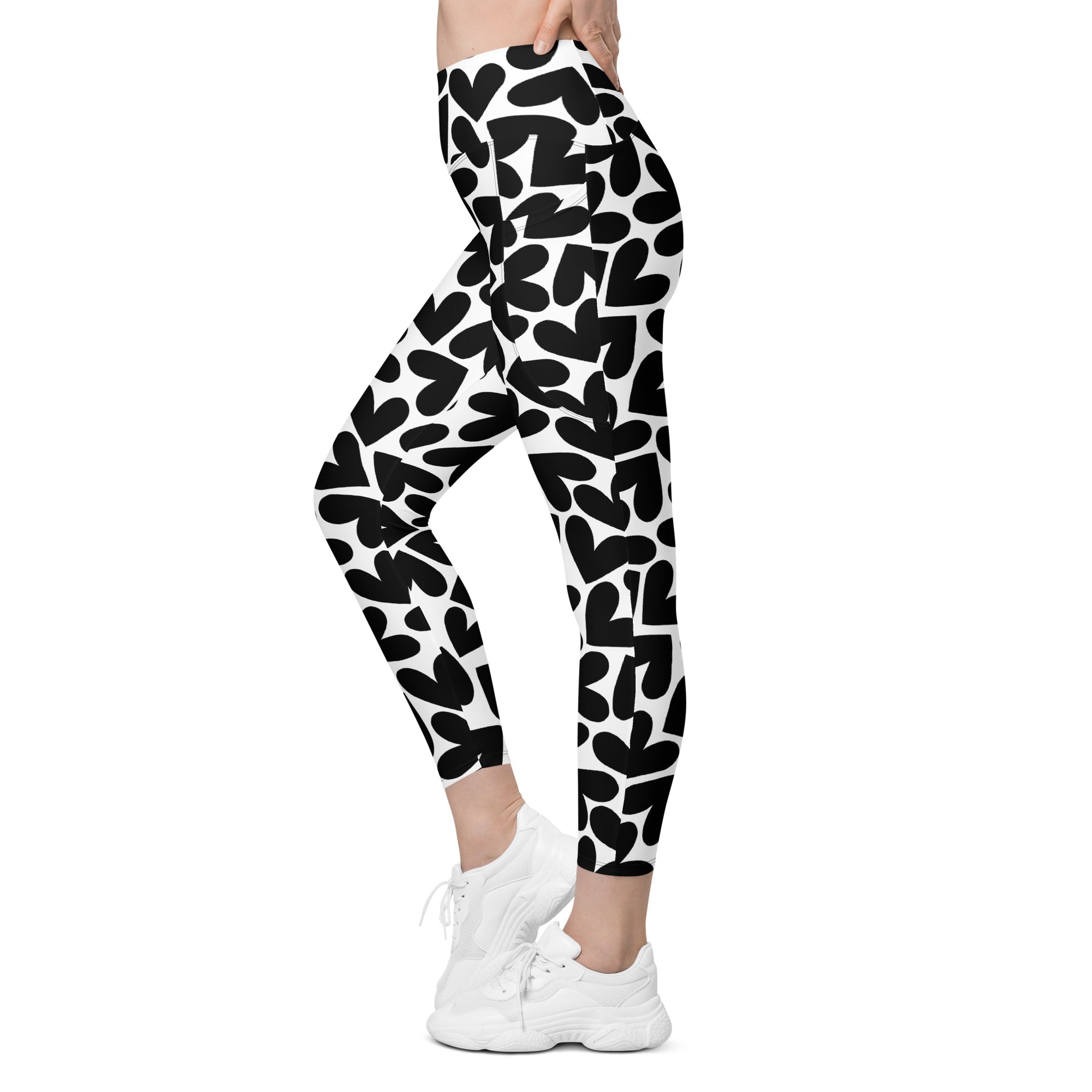 Black and white hearts print recycled yoga leggings with pockets, left view
