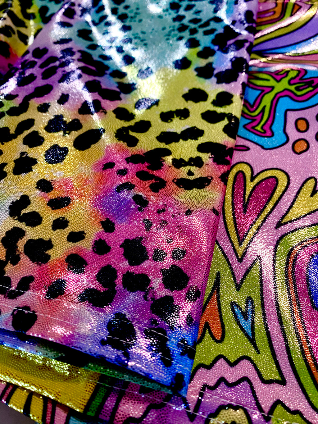 Colorful animal print glitter shorts fabric close up view