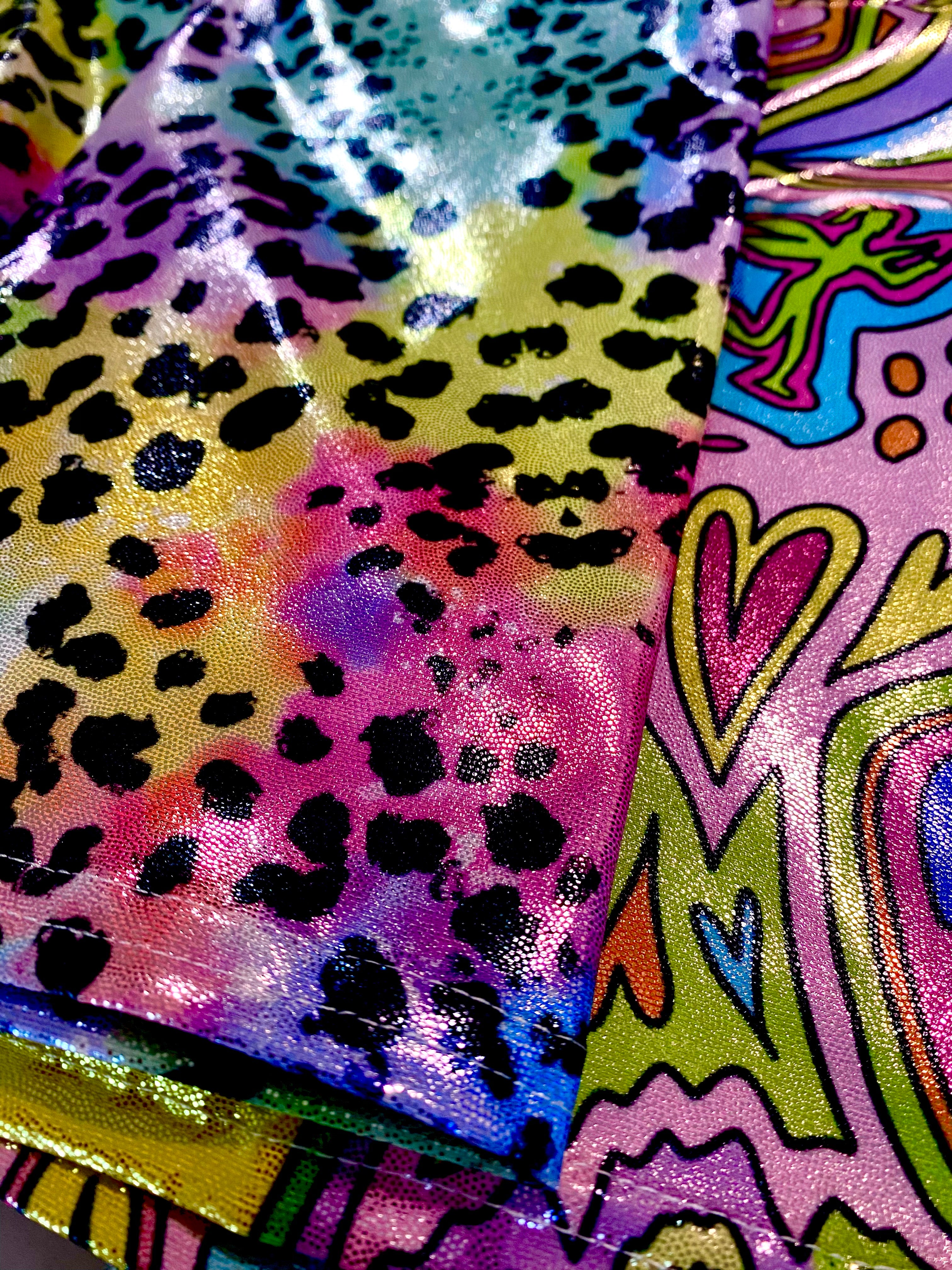Colorful animal print glitter shorts fabric close up view