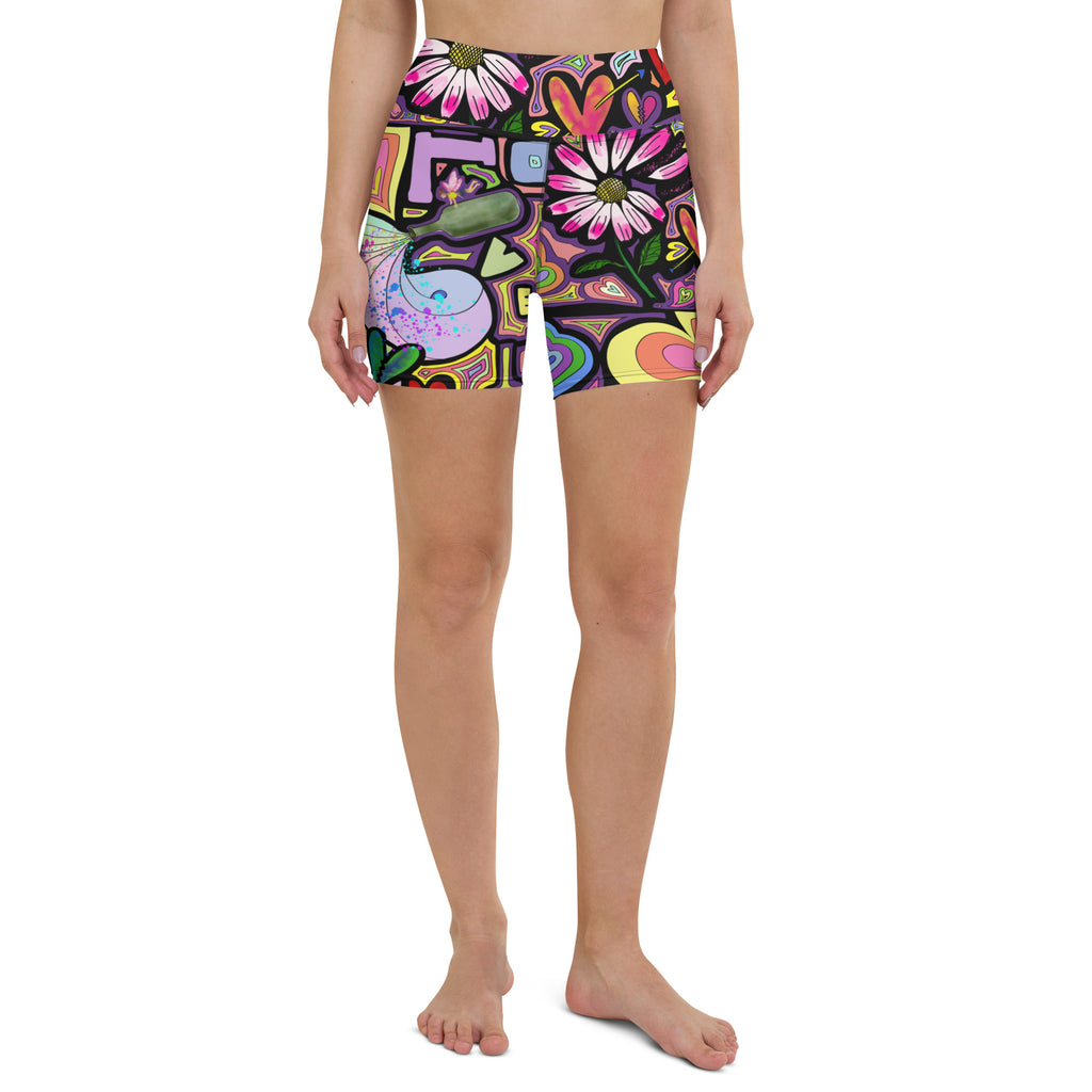 Colorful short yoga shorts with fairy dust black print front side view on person