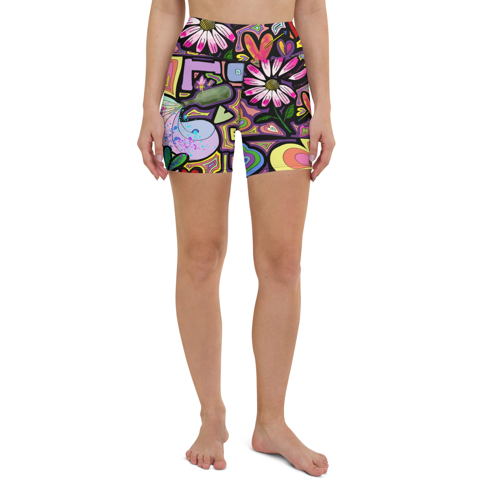Colorful short yoga shorts with fairy dust black print front side view on person