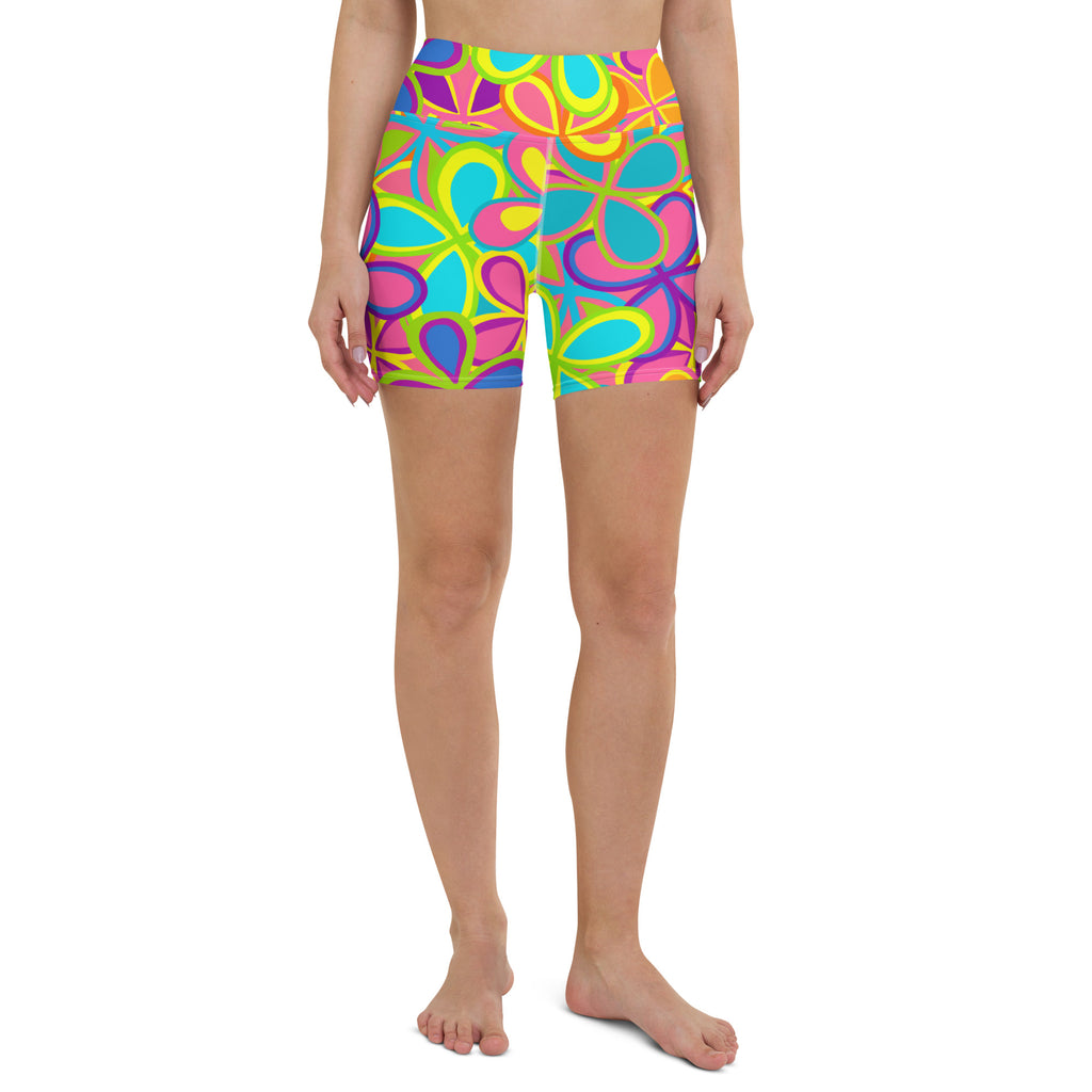 A pair of high-waisted yoga shorts with a vibrant turquoise, pink, and green floral pattern front view