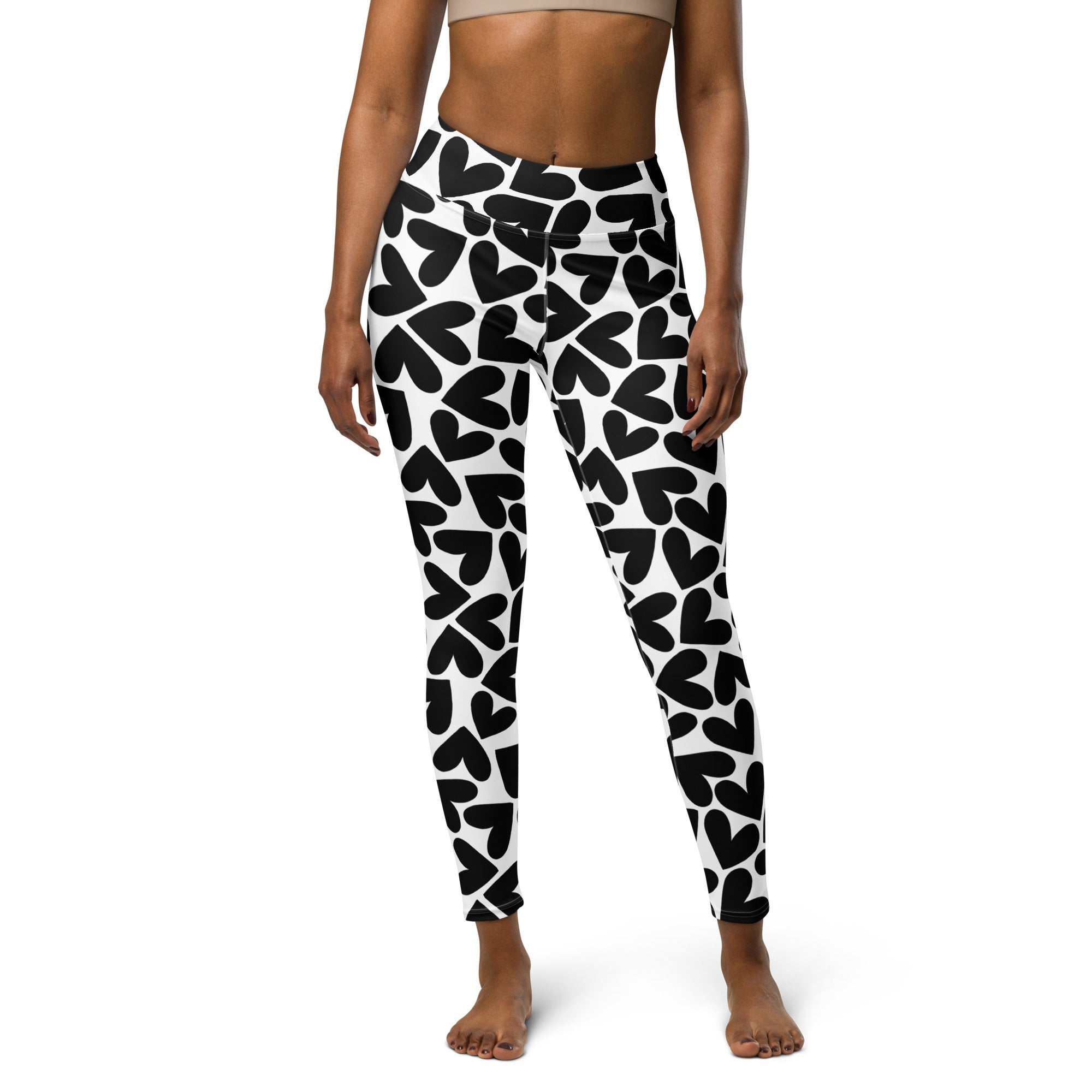 Colorful soft yoga leggings with black and white hearts pattern print, front side