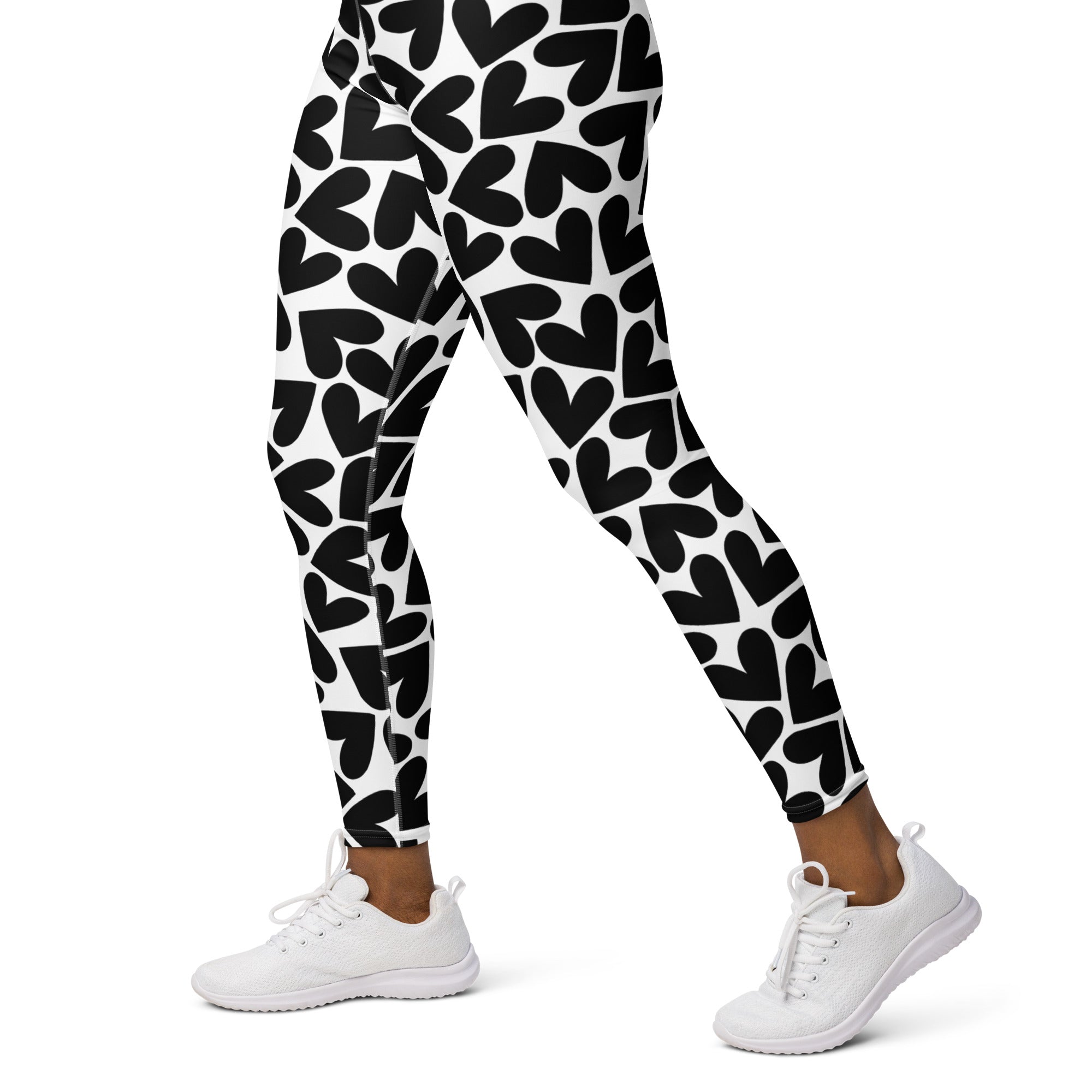 Colorful soft yoga leggings with black and white hearts pattern print, left side