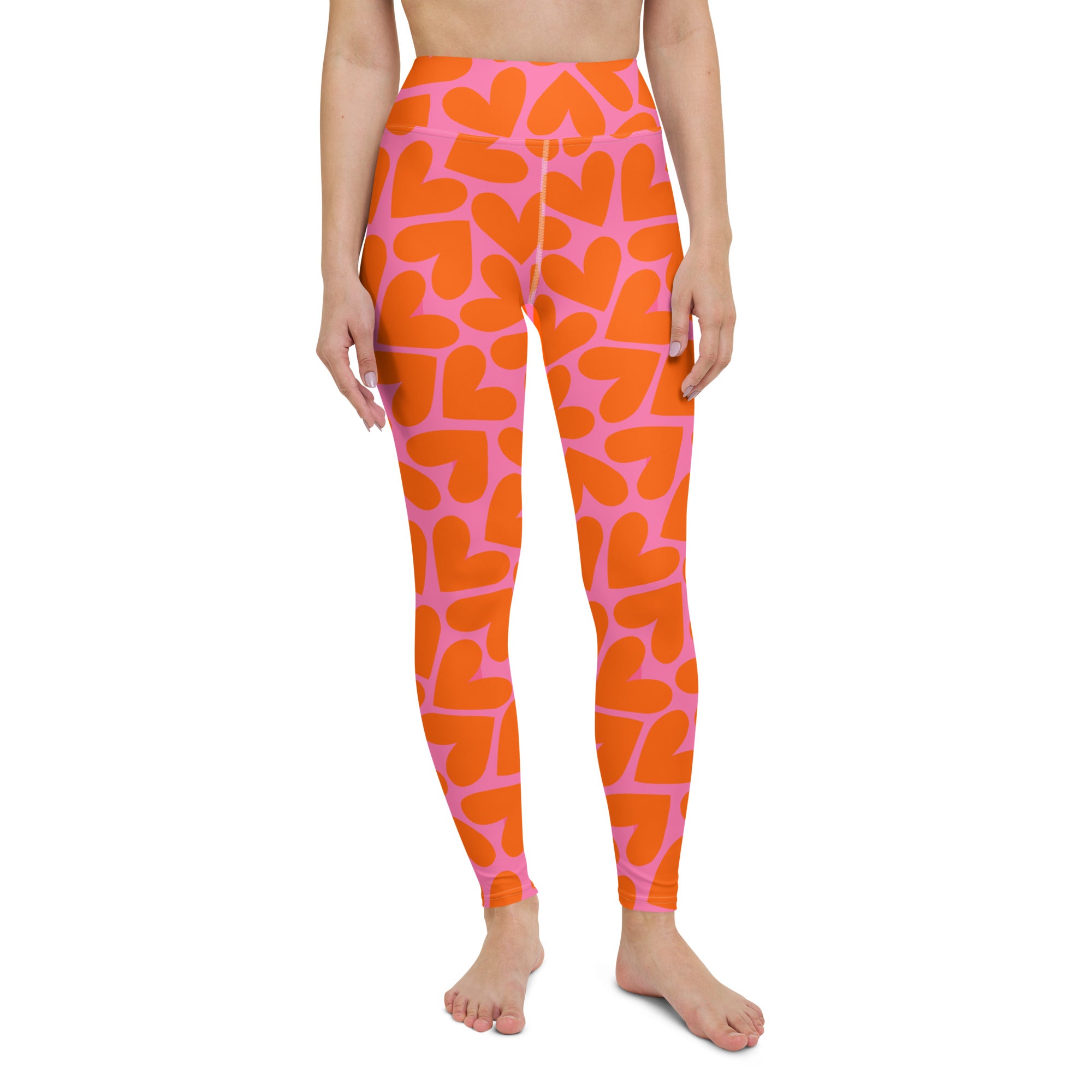Colorful soft yoga leggings with pink and orange hearts pattern print, front side