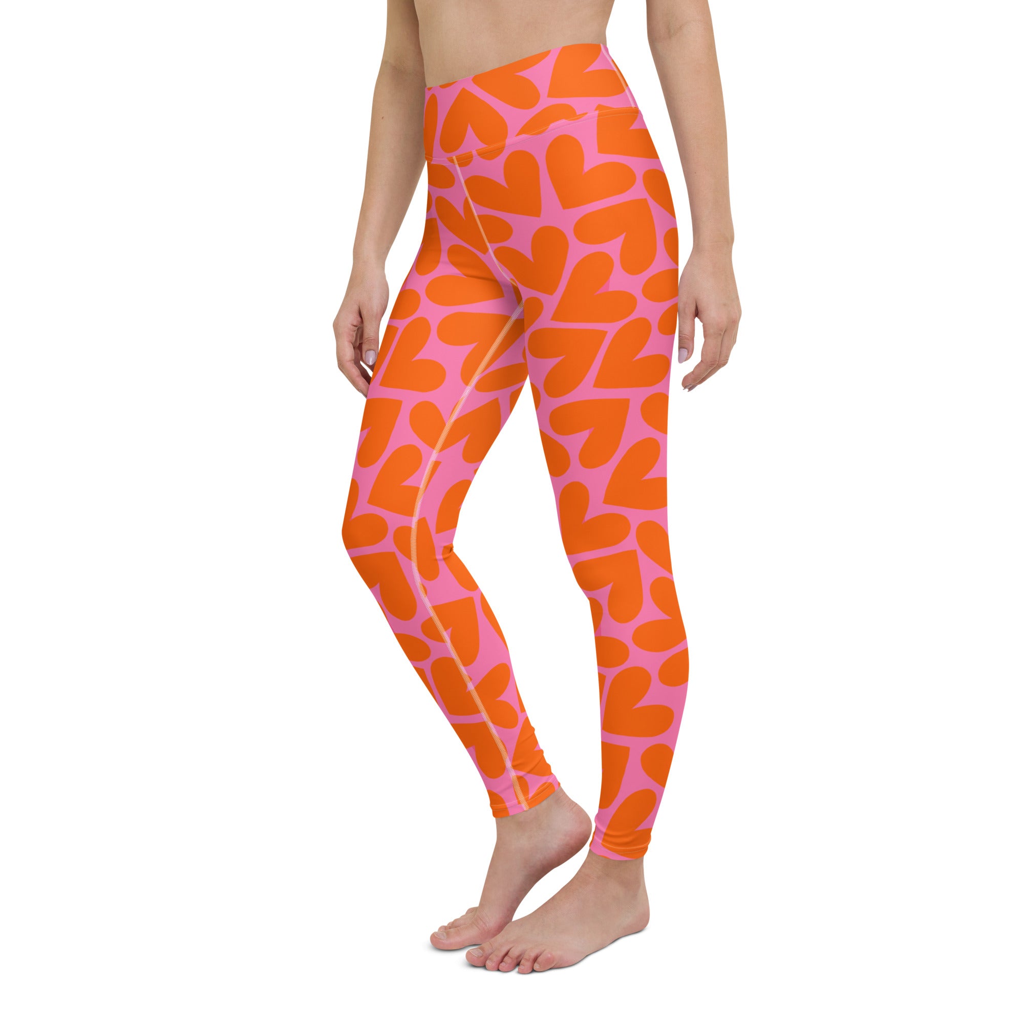 Colorful soft yoga leggings with orange and pink hearts pattern print, left front side