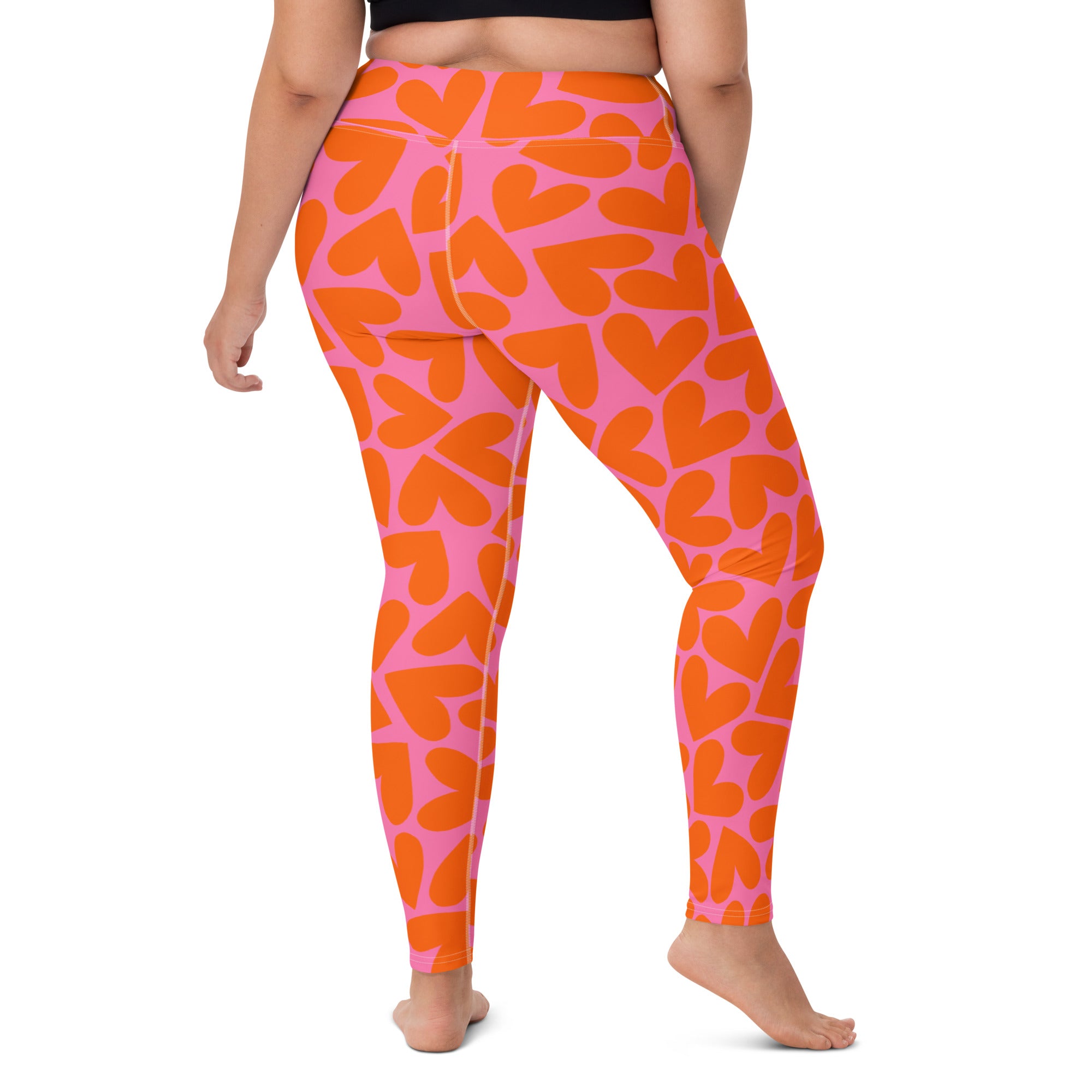 Colorful soft yoga leggings with pink and orange hearts pattern print, back side