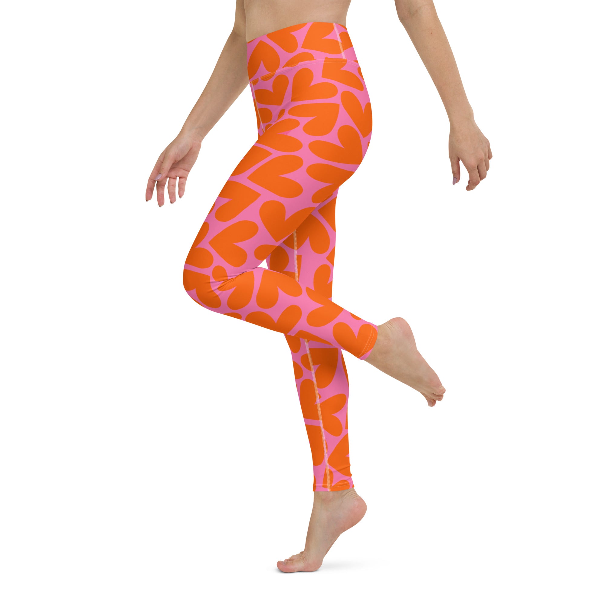 Colorful soft yoga leggings with pink and orange hearts print, left side