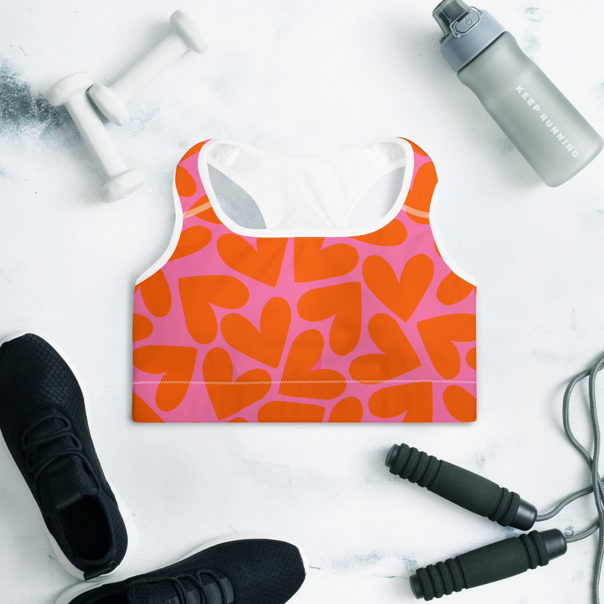 Colorful sports bra with pink and orange hearts print front side