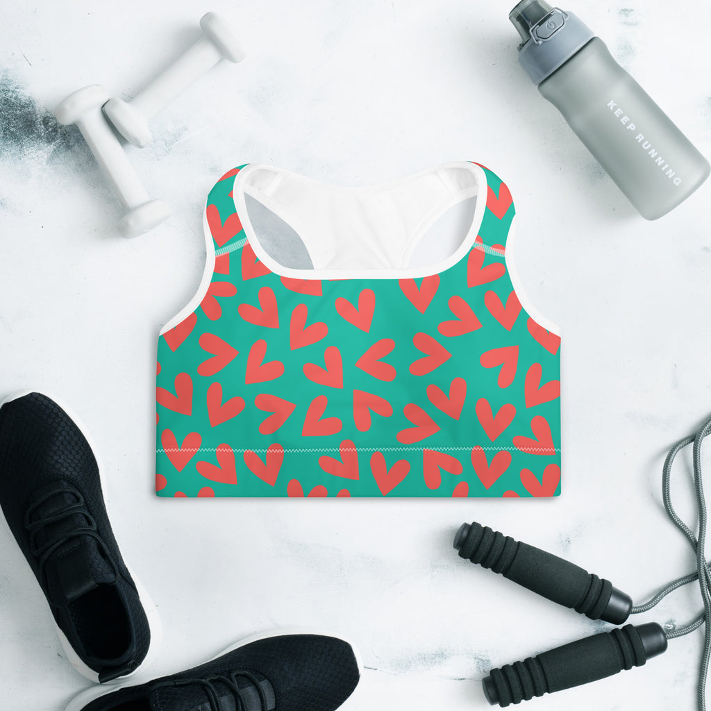 Colorful sports bra with teal and coral hearts print front side