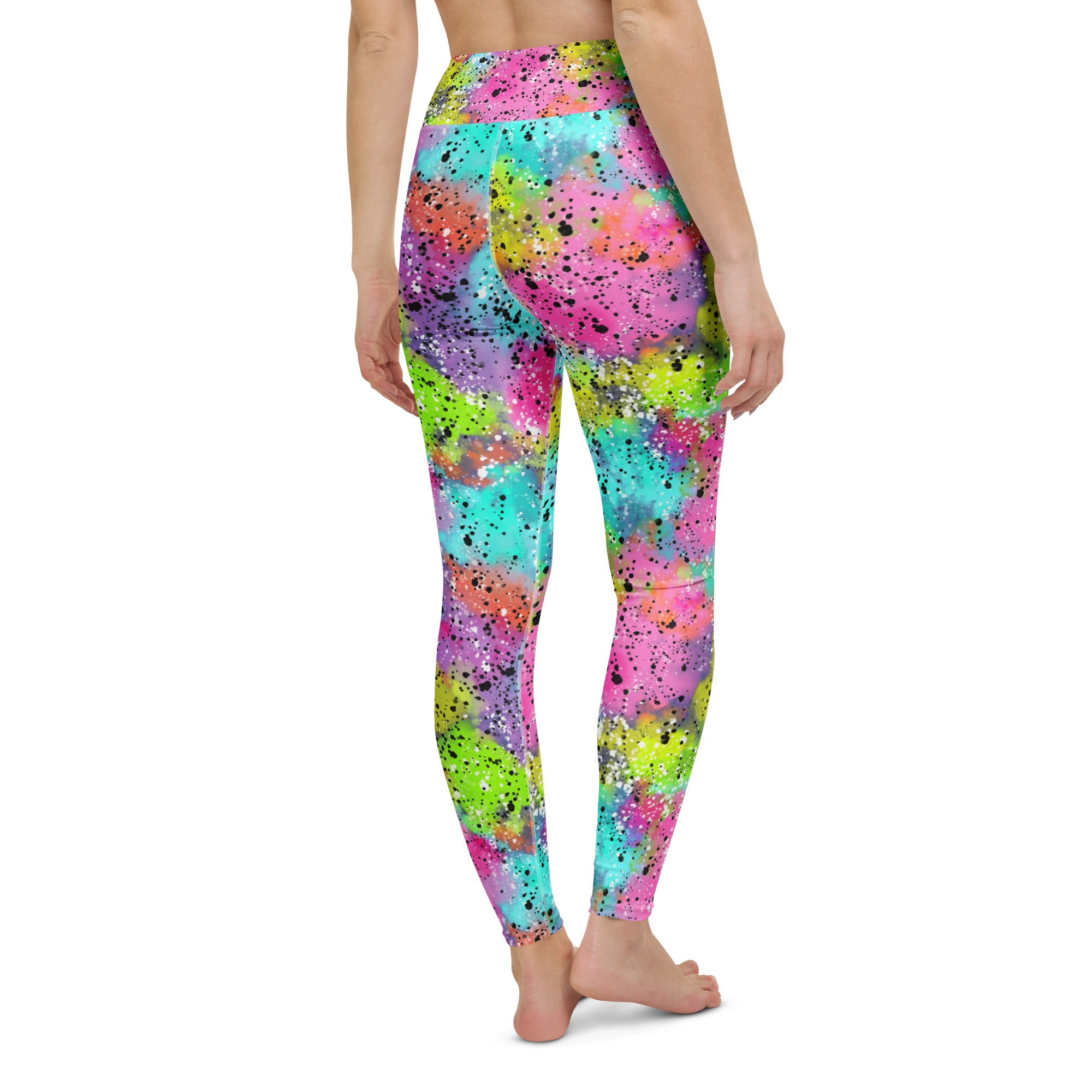 Colorful yoga leggings with rainbow galactic print on model, back side view