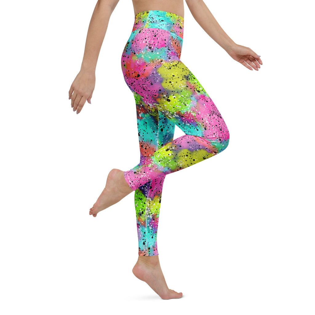 Colorful rainbow galactic patterned leggings worn by a person seen from the right side
