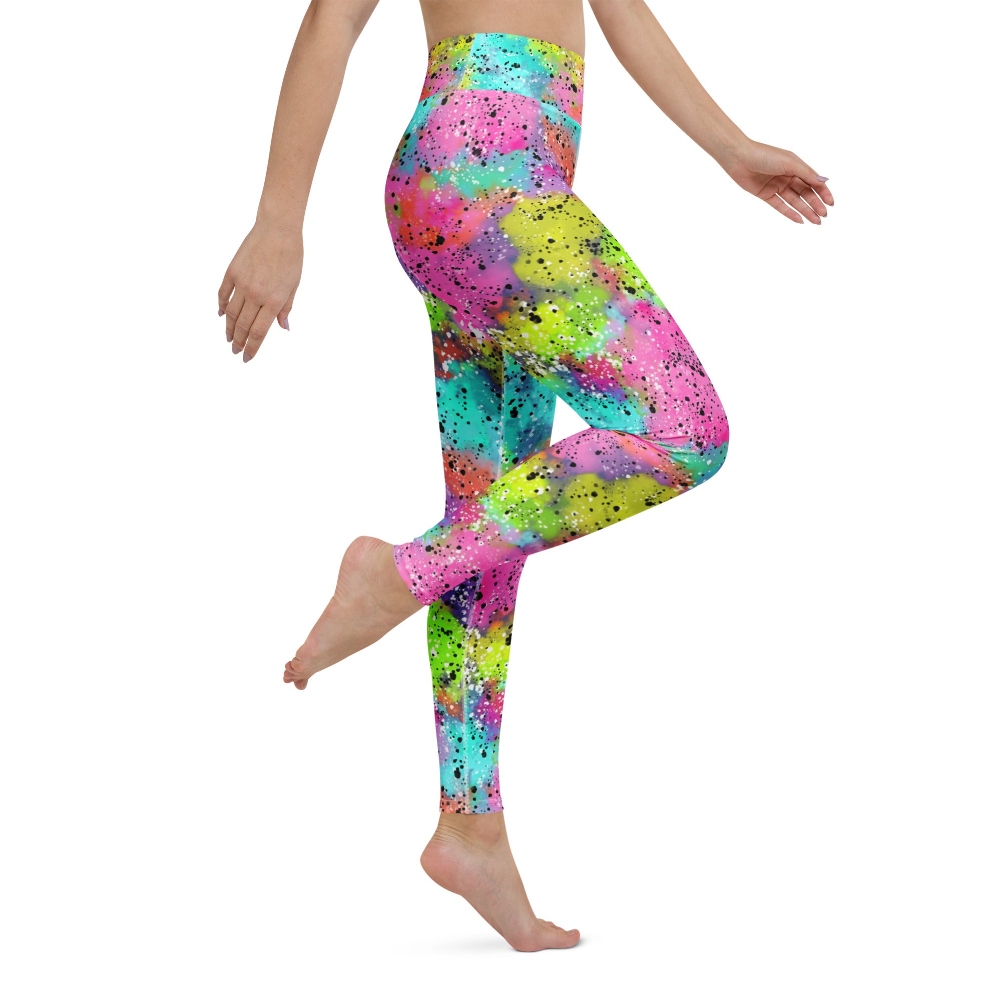 Colorful rainbow galactic patterned leggings worn by a person seen from the right side