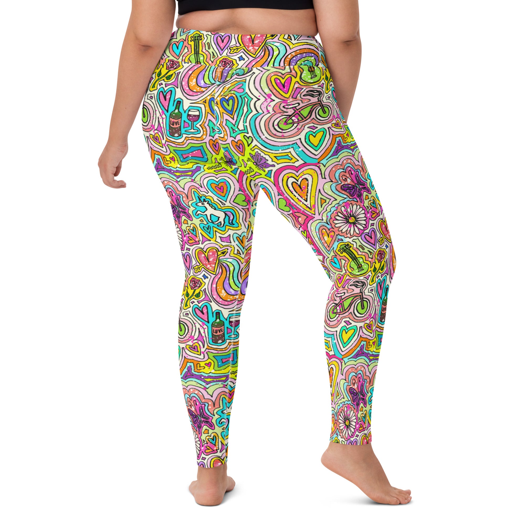 Colorful pair of yoga leggings with unicorn doodle pattern, back view