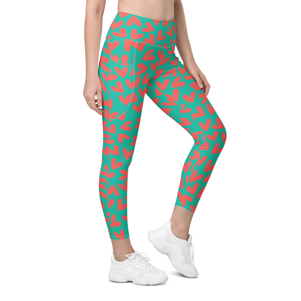 Colorful teal and pink hearts recycled yoga leggings with pockets, right front view
