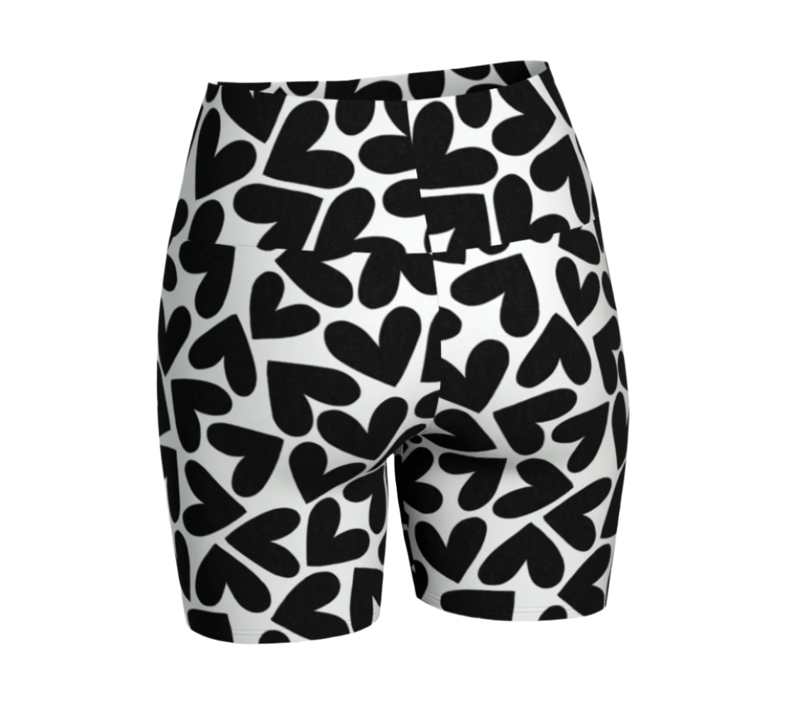 Black and white heart patterned shorts on a white background