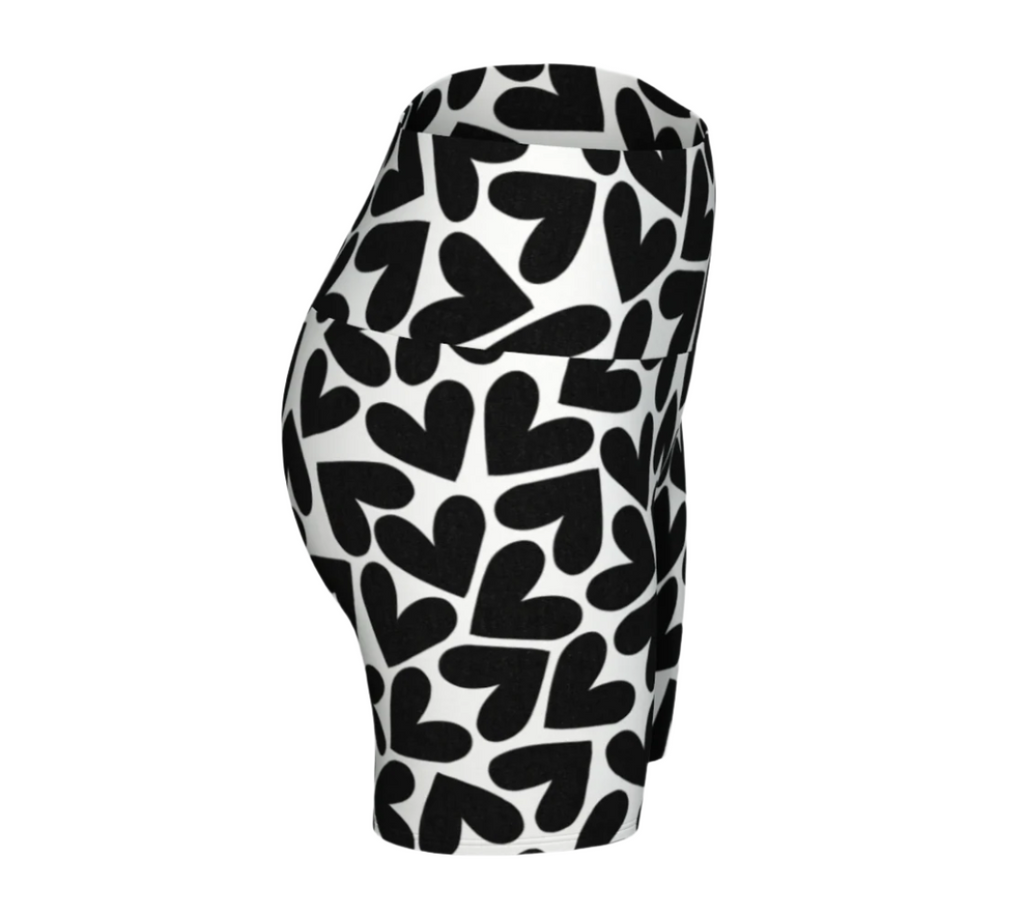 Black and white heart patterned yoga shorts on a white background