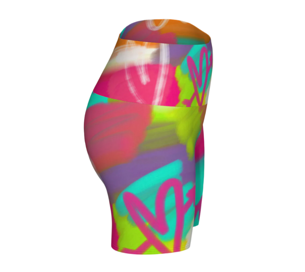 Colorful abstract patterned high-waisted yoga shorts on a white background