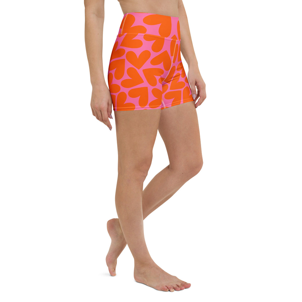 Colorful short yoga shorts with orange and pink hearts pattern print, front right side