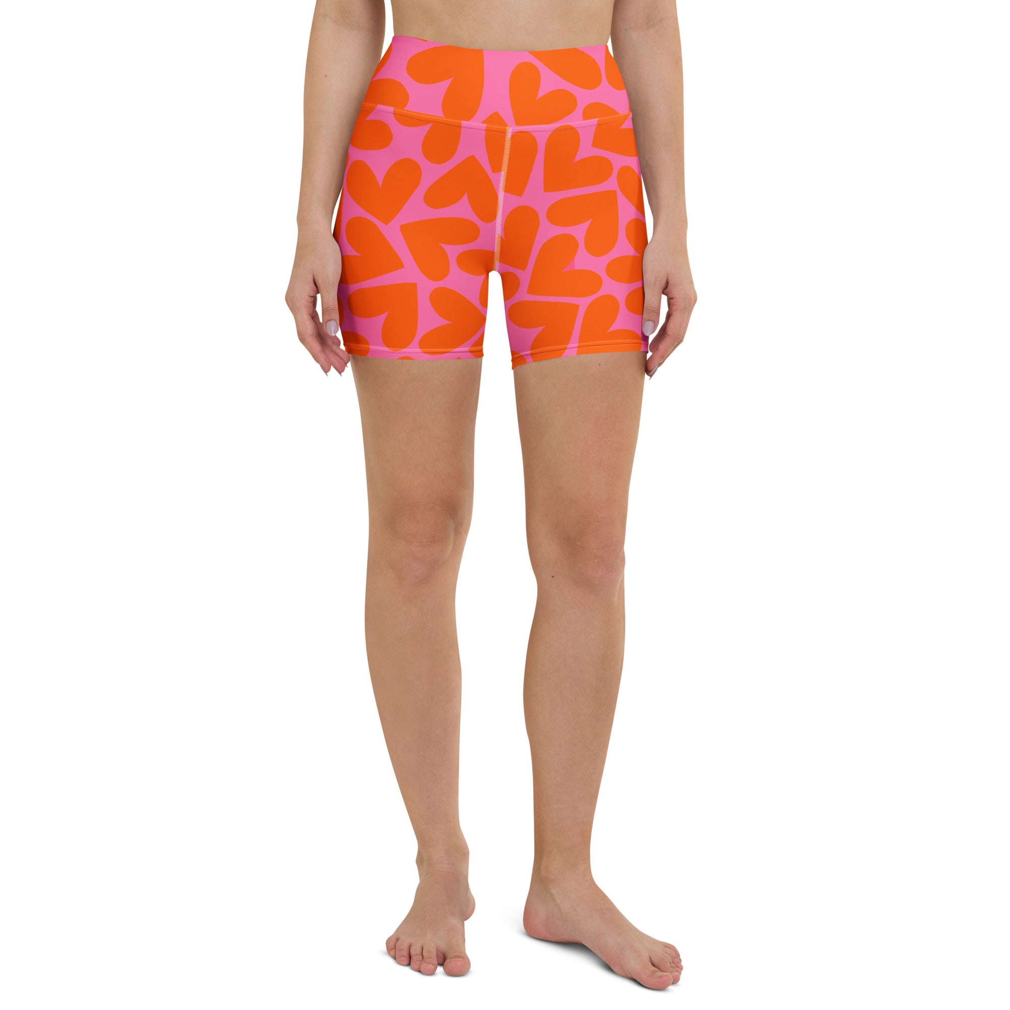 Colorful short yoga shorts with pink and orange hearts print, front