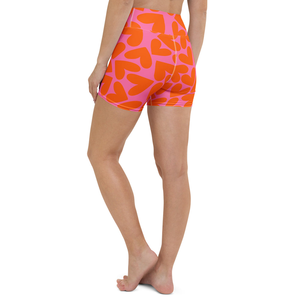 Colorful short yoga shorts with orange and pink hearts print, left back side