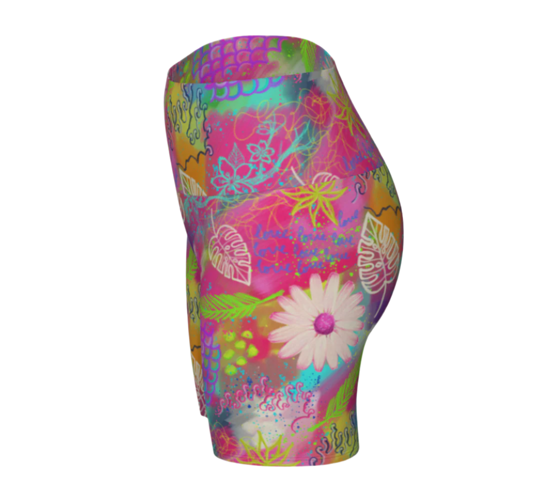 Colorful floral-patterned pink yoga shorts on a white background