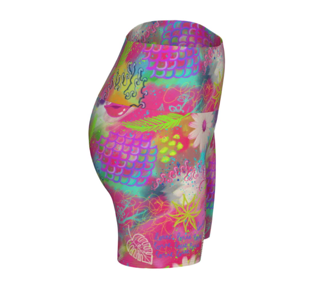 Colorful pink tropical patterned shorts on a white background