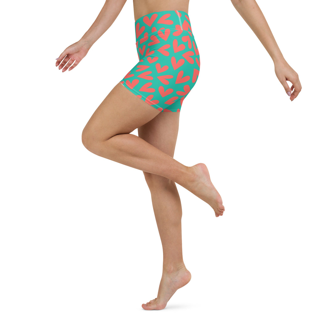 Colorful yoga shorts with teal and coral hearts print left side view