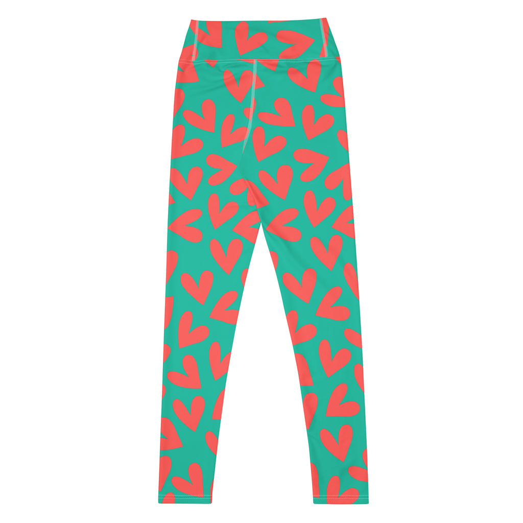 Yoga leggings with teal and pink hearts pattern flat view