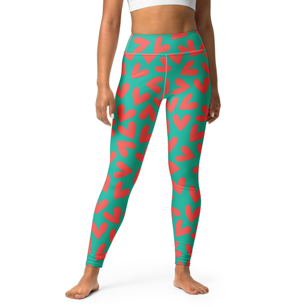 Yoga leggings with teal and pink hearts pattern front view