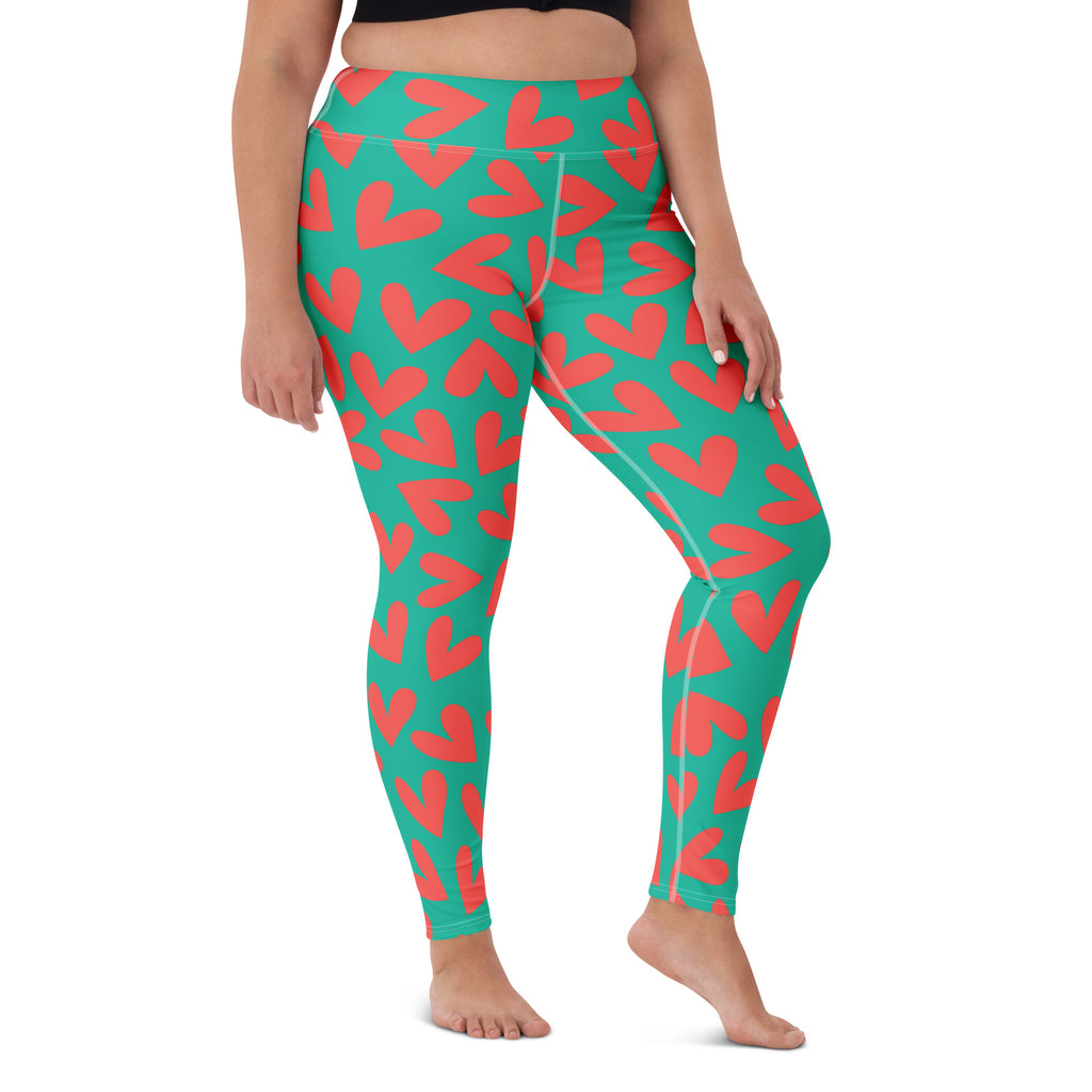 Yoga leggings with teal and pink hearts pattern front view