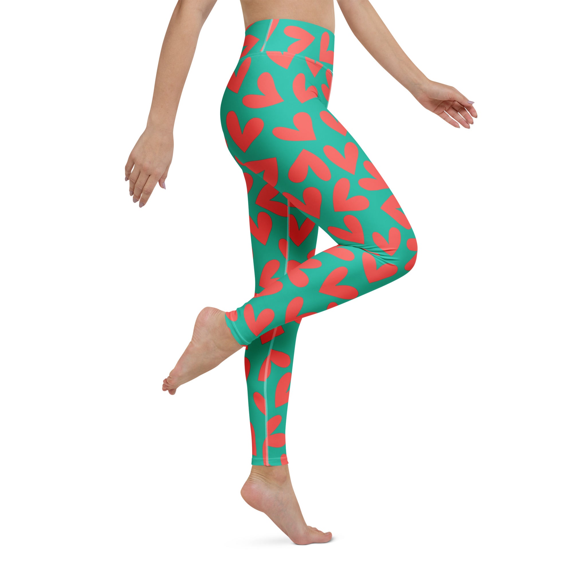 Yoga leggings with teal and pink hearts pattern side view
